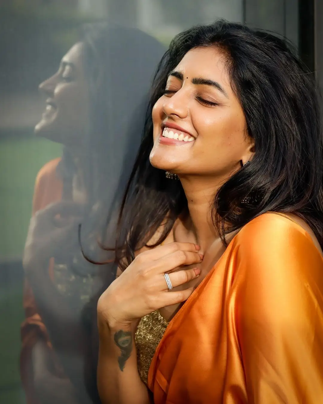 Eesha Rebba Charming Stills In Orange Saree Sleeveless Blouse